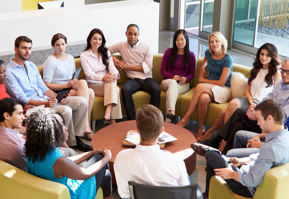 Multi-Cultural Office Staff Sitting Having Meeting Together - Agrandir l'image, fenêtre modale